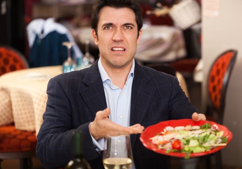 Small business owner reviewing a defamatory restaurant review